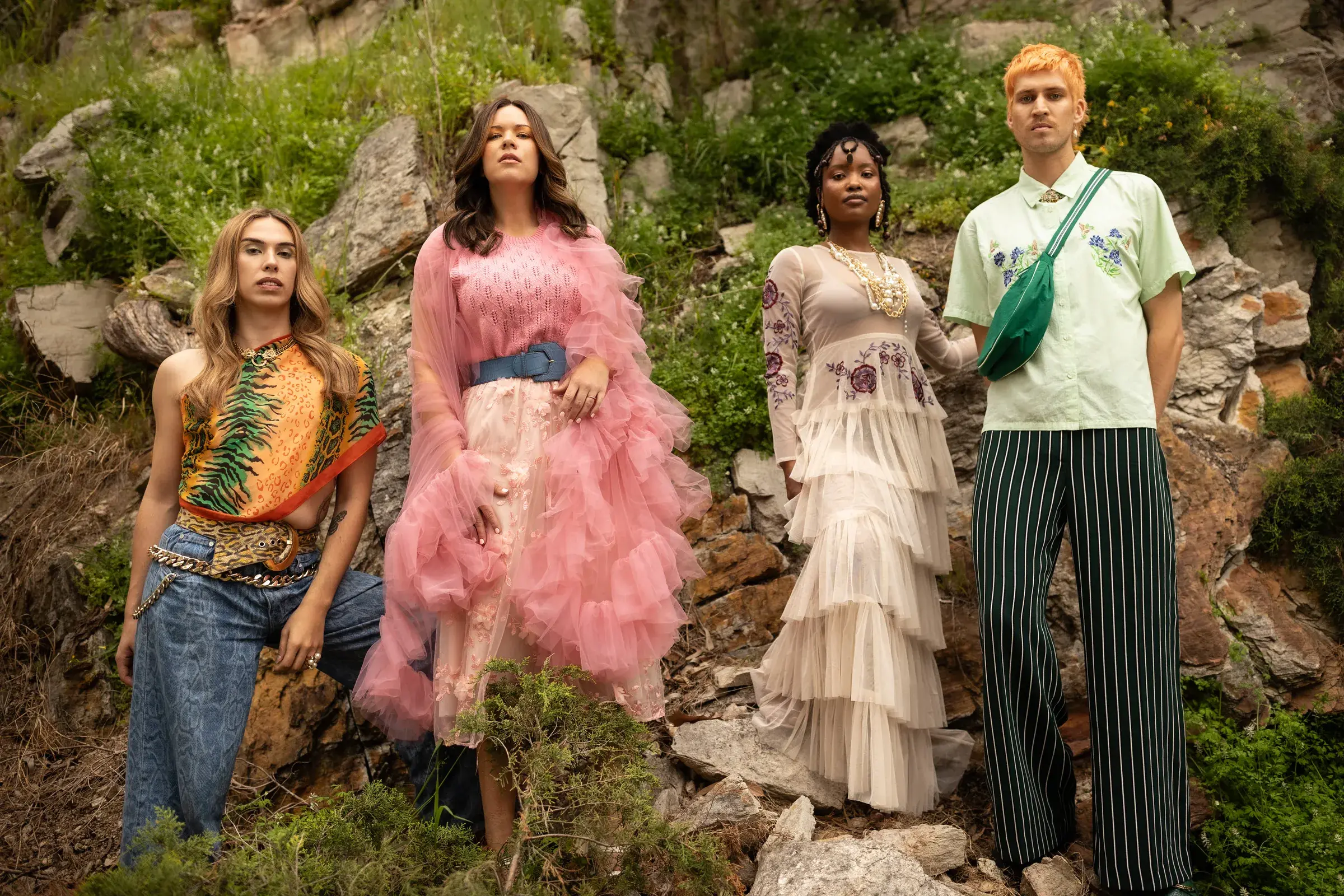 Four models showcasing diverse hairstyles and eco-luxe styling by Curjo Hair