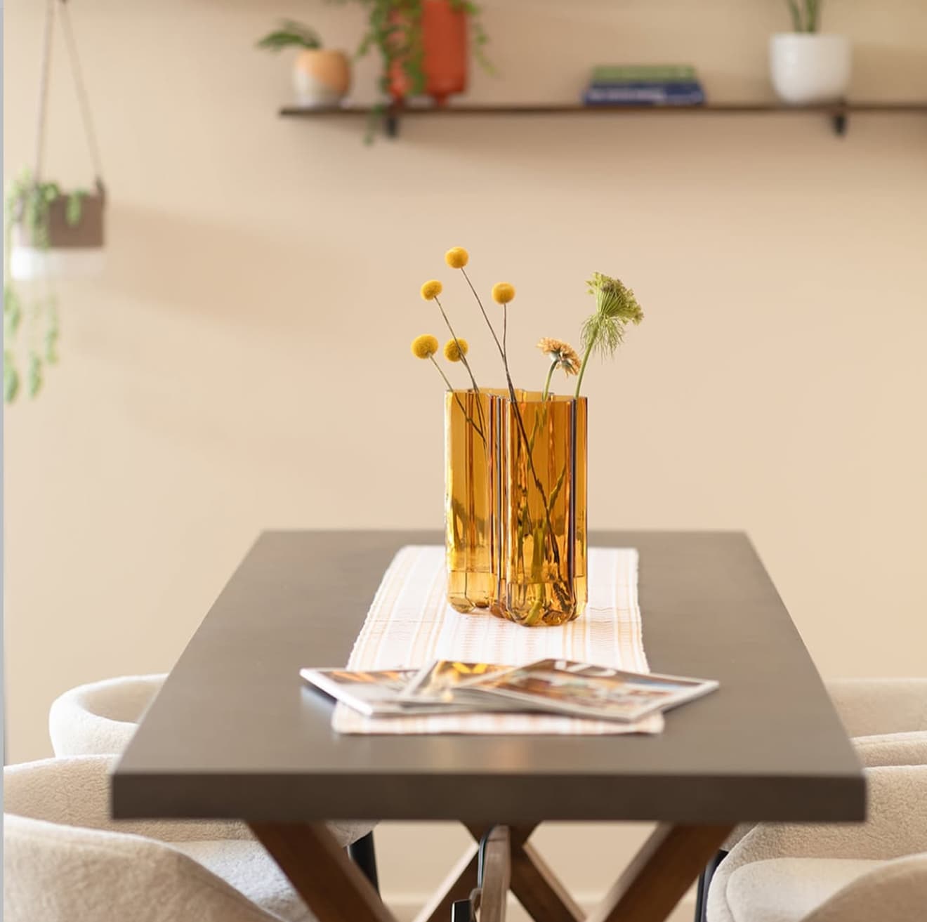 Curjo Hair salon consultation area with flowers and magazines